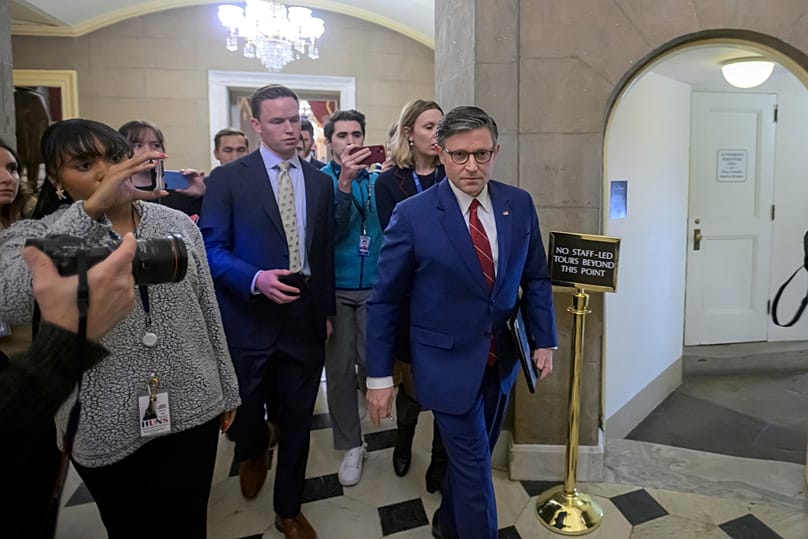 Speaker of the House Mike Johnson talks with reporters as he walks from the House chambers at the US Capitol, Wednesday, Nov. 12, 2025, in Washington.