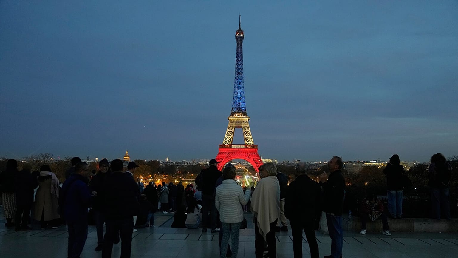 People gather in Paris, Wednesday, Nov. 12, 2025, to honour the victims of the terror attacks at the Bataclan concert hall, cafes, and the national stadium 10 years ago.
