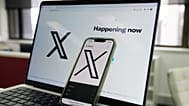 he opening page of X is displayed on a computer and phone, Oct. 16, 2023, in Sydney