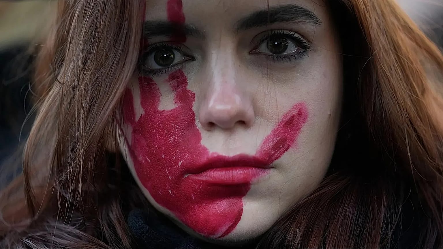 A woman attends a demonstration on the occasion of International Day for the Elimination of Violence against Women in Milan, 25 November, 2023