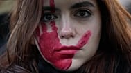 A woman attends a demonstration on the occasion of International Day for the Elimination of Violence against Women in Milan, 25 November, 2023