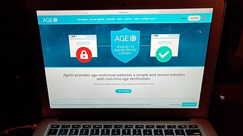 This photo taken in London on Monday July 8, 2019, shows a laptop screen displaying the website for AgeID, an age verification system. 