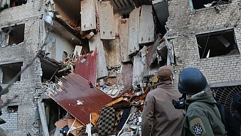Rescuers attend to the scene after a Russian missile hit a hostel in Zaporizhzhia, 30 October, 2025