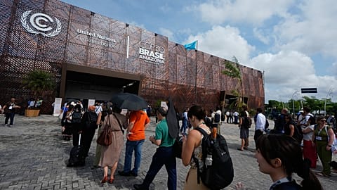 Attendees arrive to enter the venue for the COP30 UN Climate Summit.