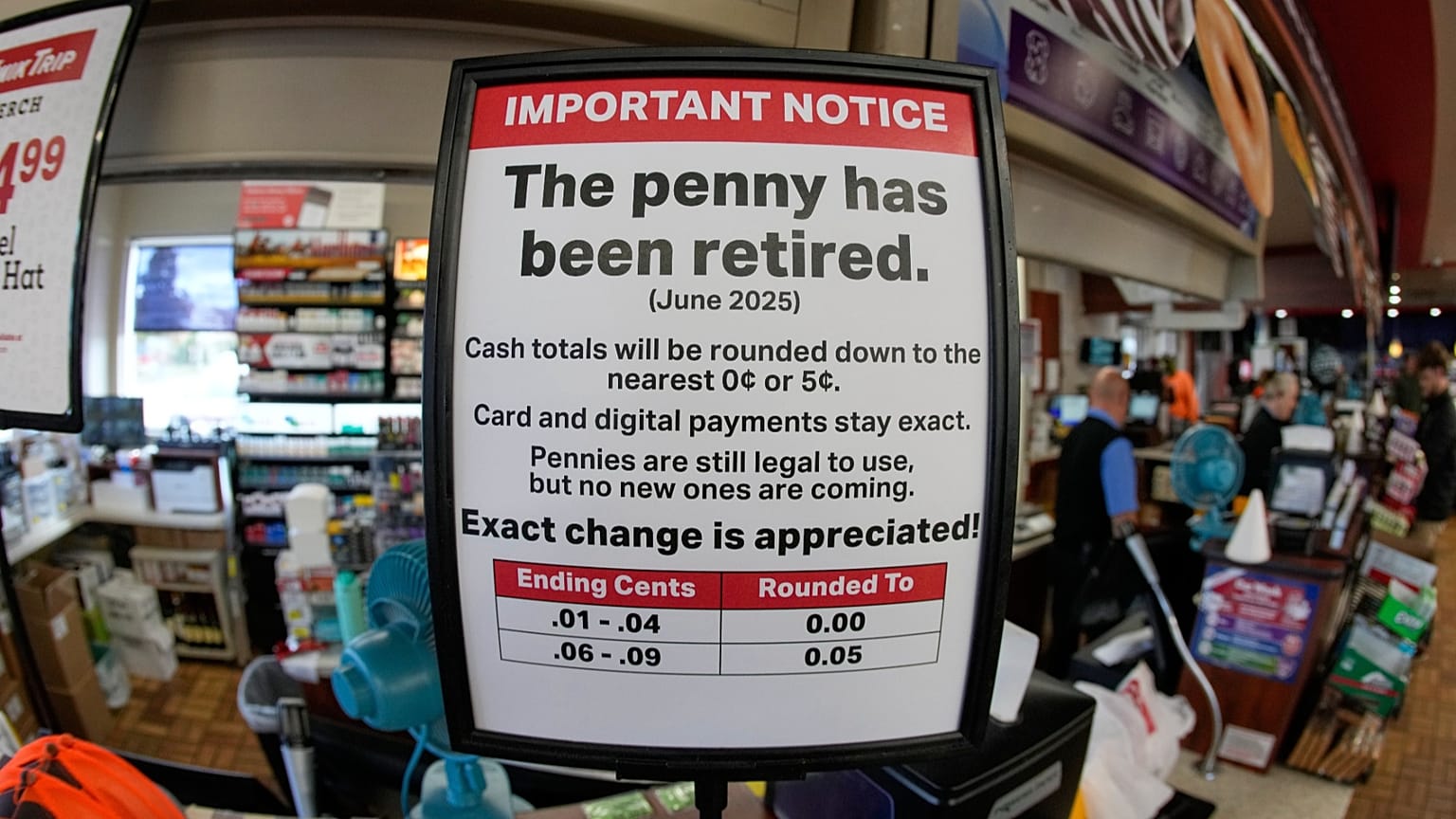 FILE - A sign in a Kwik Trip store shows the store will no longer be using pennies to give change, Oct. 23, 2025, in Yorkville, Wis.