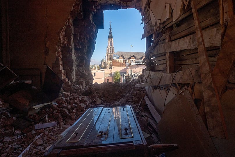 A city view through the hole from inside the kindergarten damaged following a Russia's drone attack in Kharkiv, 22 October 2025