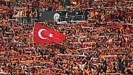 Galatasaray fans cheer during a Turkish Super Lig soccer match between Galatasaray and Fenerbahçe in Istanbul, 19 May, 2024