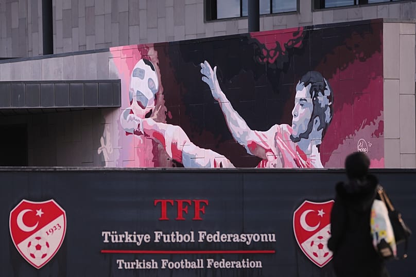 A Turkish flag waves at the Turkish Football Federation headquarters in Istanbul, 12 November, 2025
