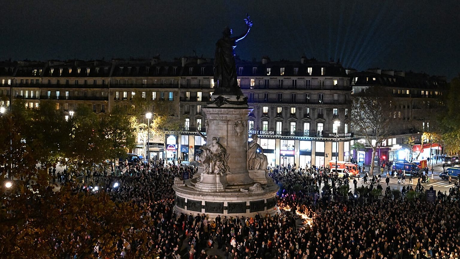 People gather at the Place de la Republique as Paris is marking the 10th anniversary of terrorist attacks that killed 132 people and injured hundreds, Nov. 13, 2025 in Paris.