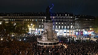 People gather at the Place de la Republique as Paris is marking the 10th anniversary of terrorist attacks that killed 132 people and injured hundreds, Nov. 13, 2025 in Paris.