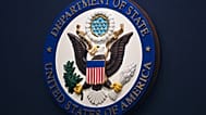 FILE: The US State Department seal is seen on the briefing room lectern at the State Department HQ in Washington, 31 January 2022