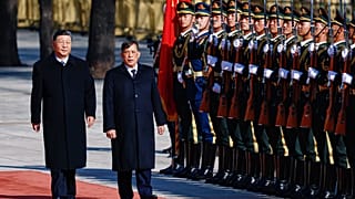 Thailand's King Maha Vajiralongkorn, right, and Chinese President Xi Jinping review the honor guard during a welcoming ceremony at the Great Hall of the People in Beijing,