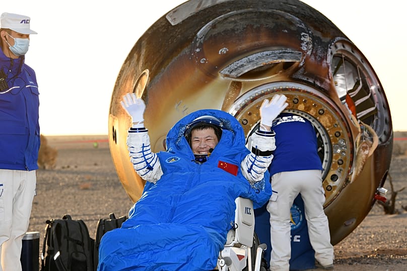 Astronaut Wang Jie leaves the Shenzhou-21 spaceship's return capsule in northern China's Inner Mongolia Autonomous Region, 14 November, 2025