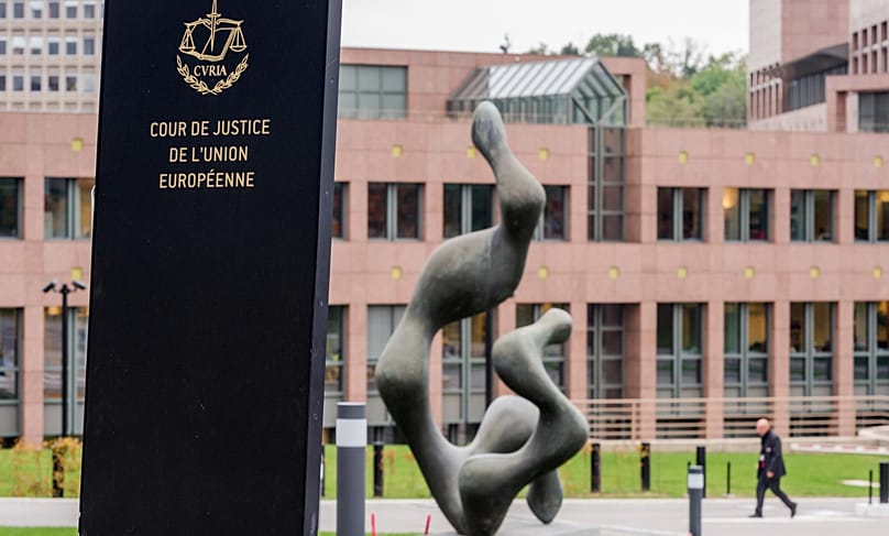 A man walks by the European Court of Justice in Luxembourg, 5 October, 2015