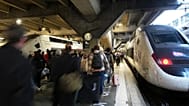 People board a train at the Montparnasse train station after a man wielding a knife was shot and wounded by police, 14 November, 2025 