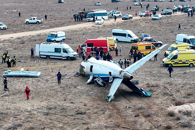 The wreckage of an Azerbaijan Airlines jet lies on the ground near the airport in Aktau, 25 December, 2024