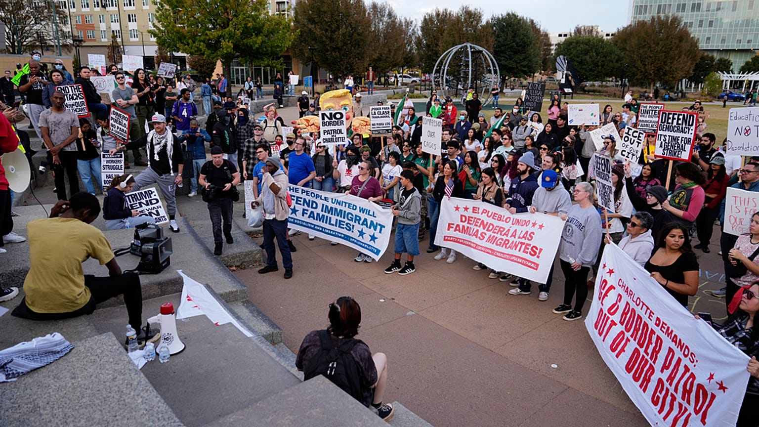 People protest against federal immigration enforcement Saturday, Nov. 15, 2025, in Charlotte, N.C. (AP Photo/Erik Verduzco)