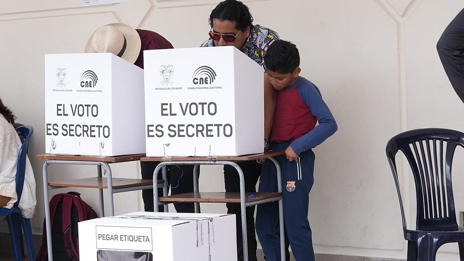People vote in a referendum on whether to allow foreign military bases in the country and rewrite the constitution through a constituent assembly, in Ecuador, Nov. 16, 2025.