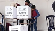 People vote in a referendum on whether to allow foreign military bases in the country and rewrite the constitution through a constituent assembly, in Ecuador, Nov. 16, 2025.