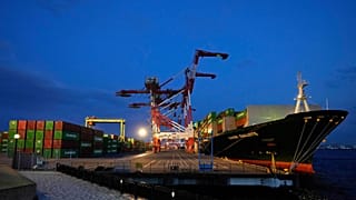 FILE. A container ship is docked at a cargo terminal in Tokyo. 9 April 2025.