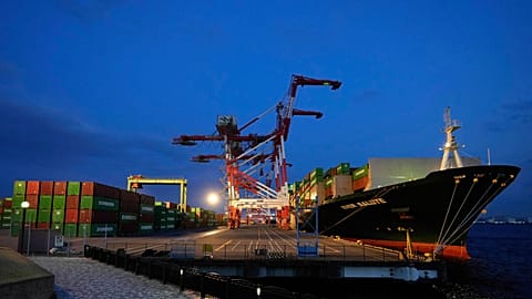 FILE. A container ship is docked at a cargo terminal in Tokyo. 9 April 2025.