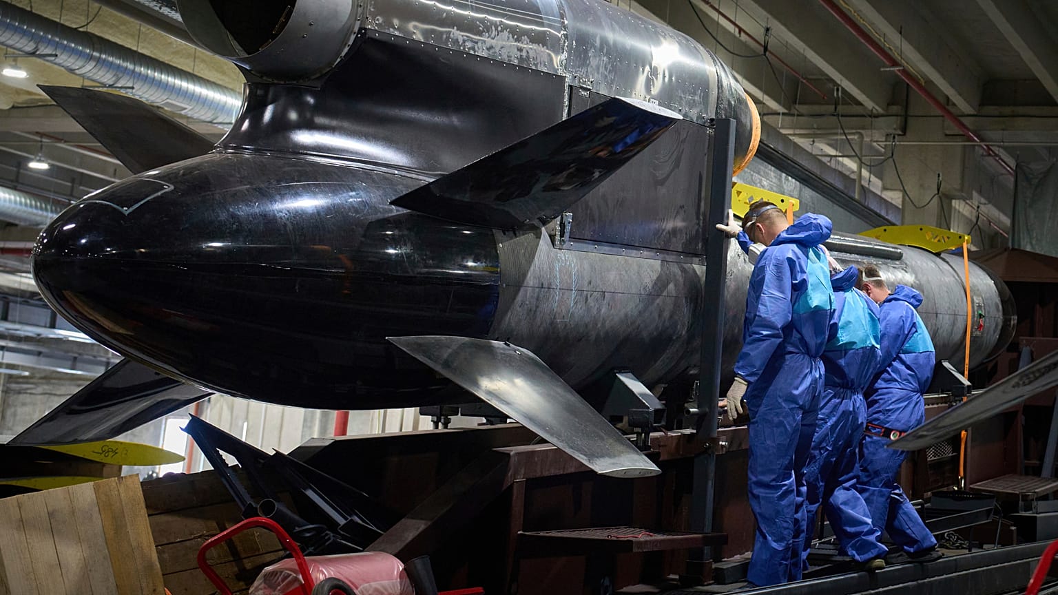 FILE - Workers inspect a Flamingo cruise missile at Fire Point's secret factory in Ukraine on Monday, Aug. 18, 2025