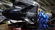 FILE - Workers inspect a Flamingo cruise missile at Fire Point's secret factory in Ukraine on Monday, Aug. 18, 2025