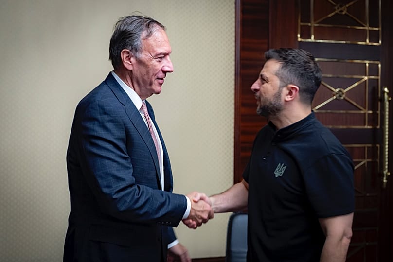 Ukrainian President Volodymyr Zelenskyy, right, shakes hands with Former U.S. Secretary of State Mike Pompeo in Kyiv, Ukraine, Friday, Sept. 13, 2024.