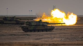 A French Leclerc main battle tank shoots during an exercise at a training range in Smardan, eastern Romania, on Jan. 25, 2023