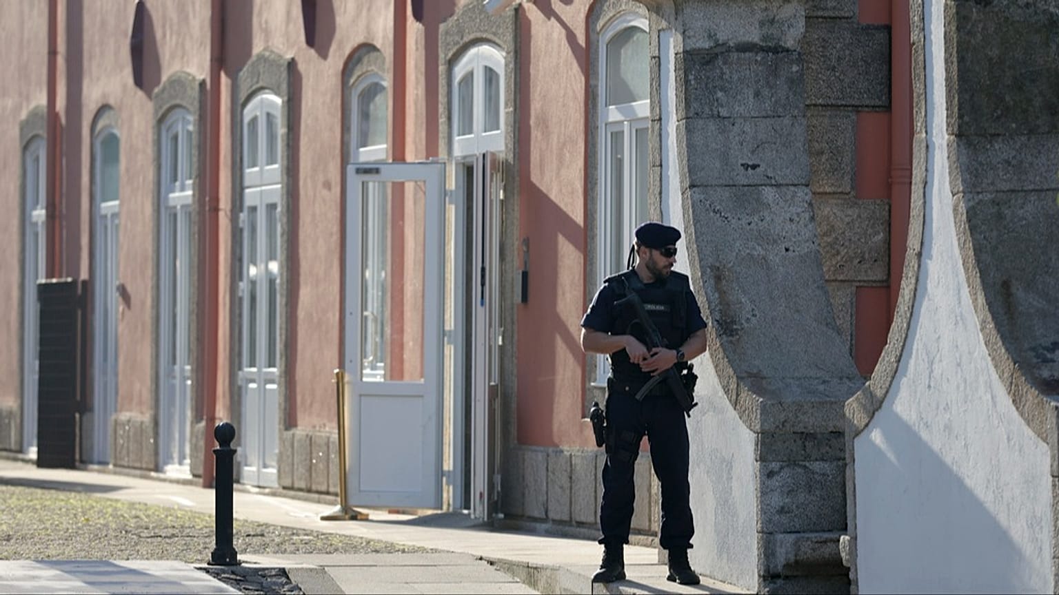 FILE: A Portuguese police officer stands outside a hotel in Porto, 6 October 2023