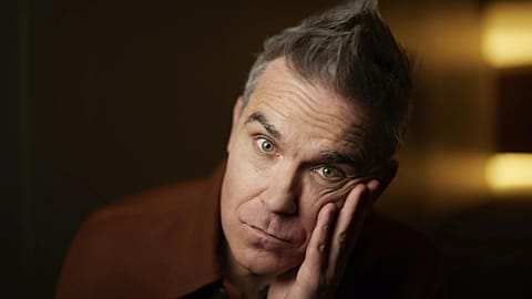 Robbie Williams, "Better Man" filminin tanıtımı için poz veriyor.