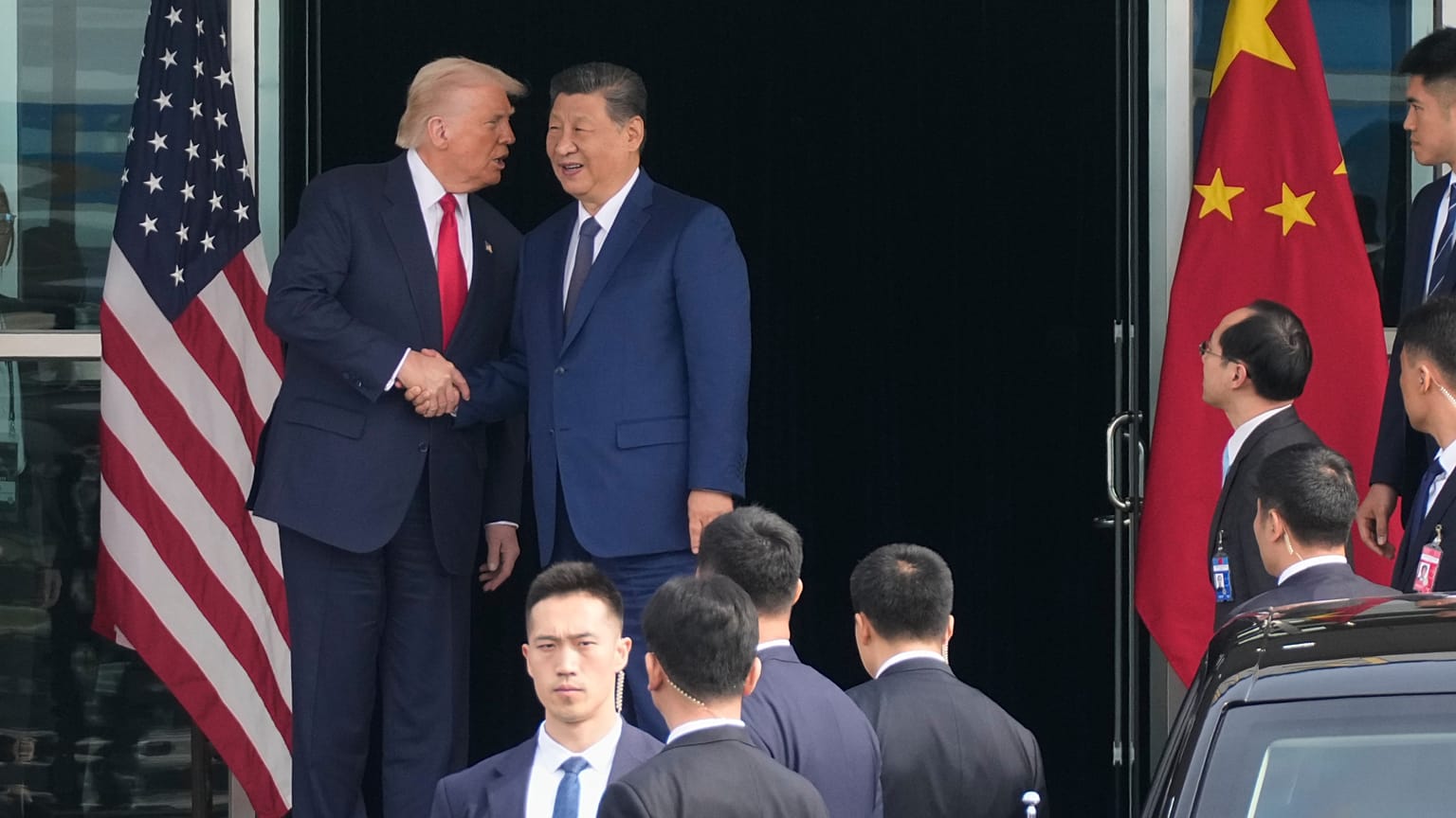 President Donald Trump left, and Chinese President Xi Jinping, shake hands before their US-China summit talk at Gimhae International Airport in South Korea. 30 Oct. 2025.
