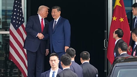 President Donald Trump left, and Chinese President Xi Jinping, shake hands before their US-China summit talk at Gimhae International Airport in South Korea. 30 Oct. 2025.