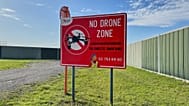 FILE: A no drone sign just outside the perimeter of Brussels International Airport in Zaventem, Belgium, after reported overnight drone activity over the airport, 5 Nov, 2025