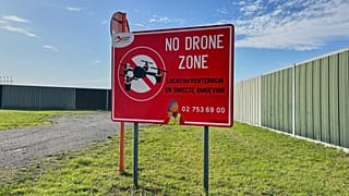 FILE: A no drone sign just outside the perimeter of Brussels International Airport in Zaventem, Belgium, after reported overnight drone activity over the airport, 5 Nov, 2025
