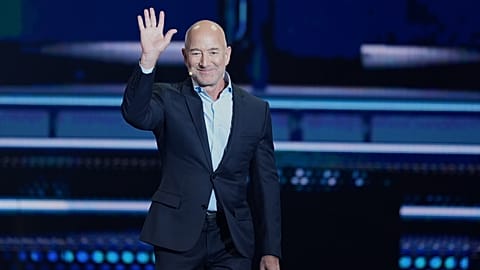 Amazon founder Jeff Bezos waves as he takes the stage at the America Business Forum, Thursday, 6 Nov, 2025.