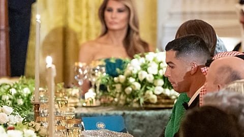 Football player Cristiano Ronaldo, listens as President Donald Trump speaks in the White House, Tuesday, Nov. 18, 2025, in Washington. (AP Photo/Alex Brandon)