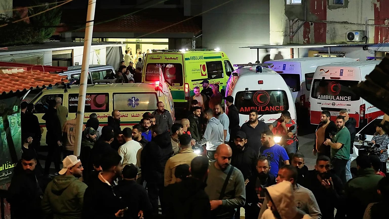 Ambulances outside a hospital where they brought the victims of the Israeli strike that hit the Ein el-Hilweh refugee camp in Sidon, Lebanon, Tuesday, Nov. 18, 2025.