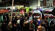 Ambulances outside a hospital where they brought the victims of the Israeli strike that hit the Ein el-Hilweh refugee camp in Sidon, Lebanon, Tuesday, Nov. 18, 2025.