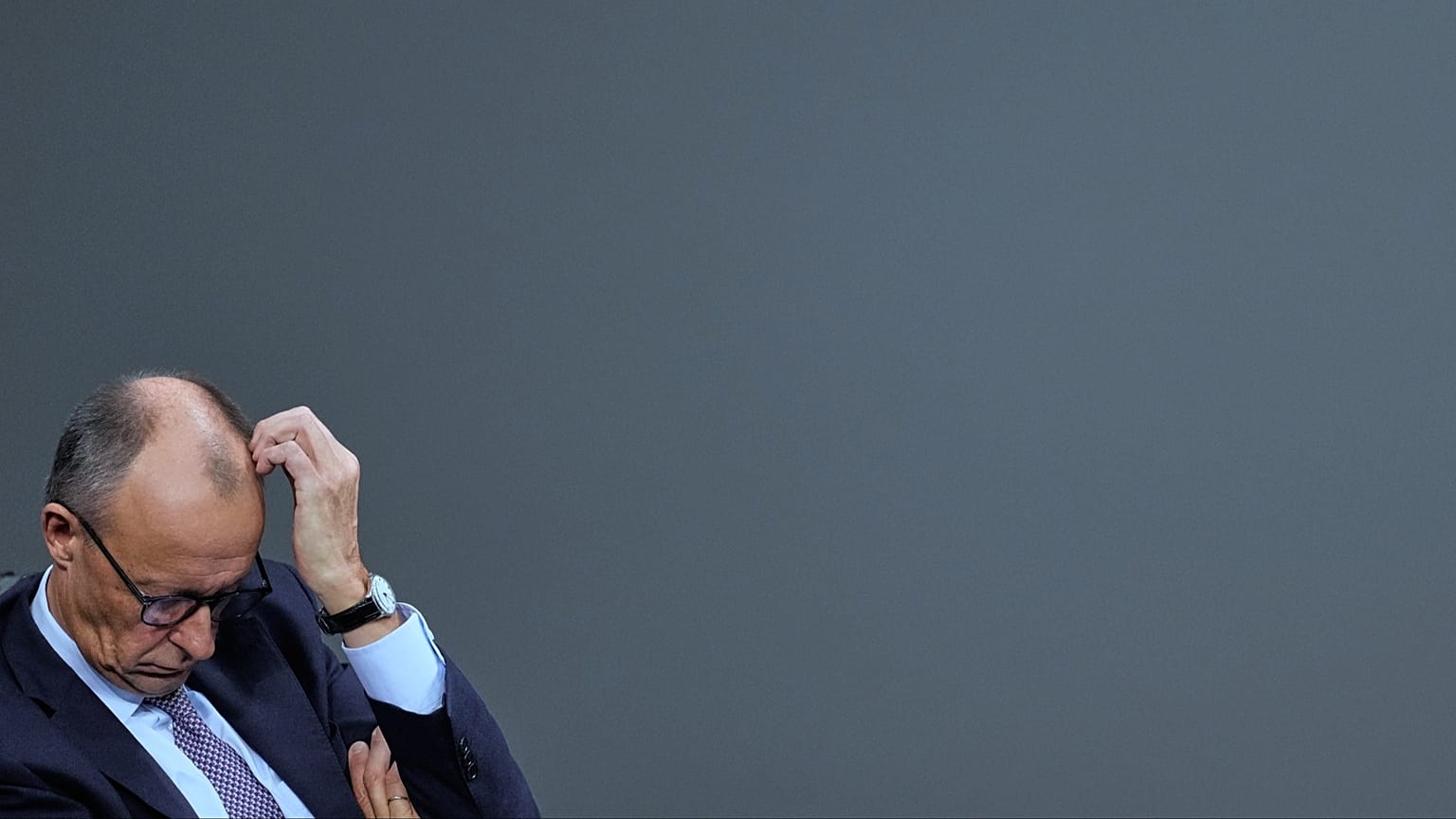 FILE: German Chancellor Friedrich Merz sits after addressing the German parliament Bundestag in Berlin, 16 October 2025