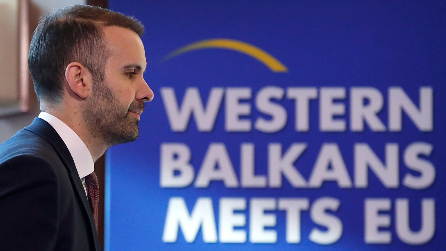 FILE: Montenegro's Prime Minister Milojko Spajic walks past a banner during the Western Balkans meets EU, Growth plan for WB - Leaders meeting, in Skopje, 22 January 2024