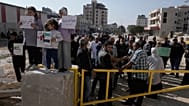 Displaced Palestinians gather during a protest calling to return to their houses in the Nur Shams refugee camp, in the West Bank city of Tulkarem, Tuesday, Nov. 18, 2025.