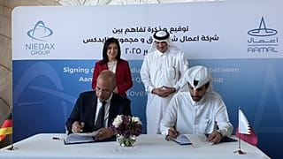 Officials attend the MoU signing in Doha.