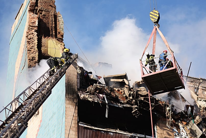 Rescue workers clear the rubble of a residential building which was heavily damaged by a Russian strike on Ternopil, 19 November, 2025