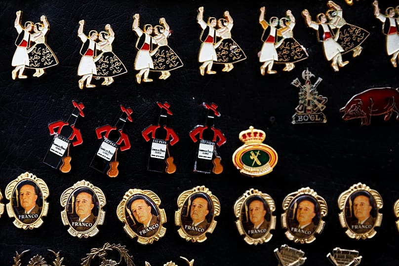 FILE: Pins are displayed for sale on a gathering to remember former Spanish Dictator Francisco Franco on the 39th anniversary of his death, in Madrid, 23 November 2014