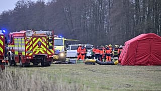 Rescuers at the scene after an express train collided with a passenger train on the line between Zliv and Dívčice in the České Budějovice region, 20 November 2025