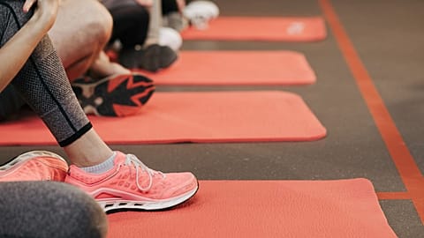 People are shown at an exercise class.