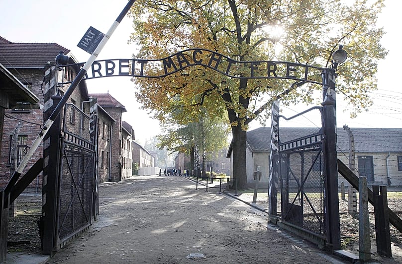 FILE - This Oct. 19, 2012 file photo shows the entrance of Auschwitz at the former Nazi German death complex of Auschwitz-Birkenau in in Oswiecim, Poland.