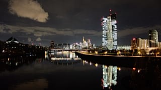 The European Central Bank is reflected in the river Main in Frankfurt, Germany. 20 Nov. 2025.