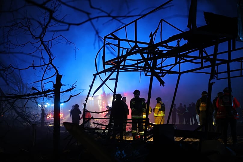 Rescues work at a market destroyed by a Russian airstrike on Zaporizhzhia, 21 November, 2025